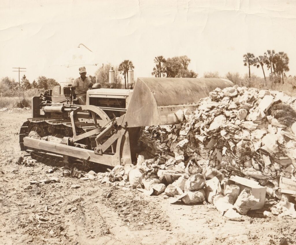 J A Davis (John Armond Davis) sitting on a bull dozer circa 1945 