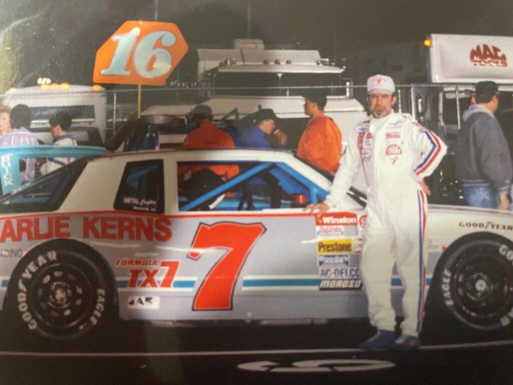 Tom Sherrill with his number 7 race car in victory lane